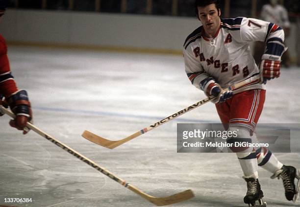 Rod Gilbert of the New York Rangers skates on the ice during an NHL game against the Montreal Canadiens circa 1972 at the Madison Square Garden in...