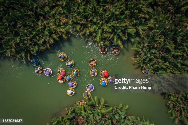 basket boat tour view in bay mau nipa palm jungle - vietnam stockfoto's en -beelden
