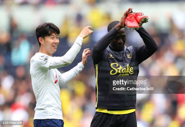 Heung-Min Son of Tottenham Hotspur interacts with Moussa Sissoko of Watford following the Premier League match between Tottenham Hotspur and Watford...