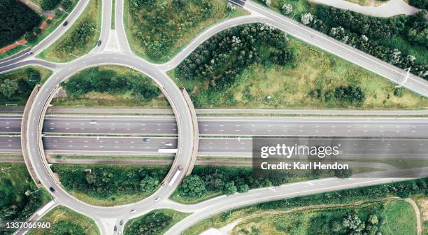 an aerial daytime view of an east flanders motorway intersection - stock photo - overpass stockfoto's en -beelden