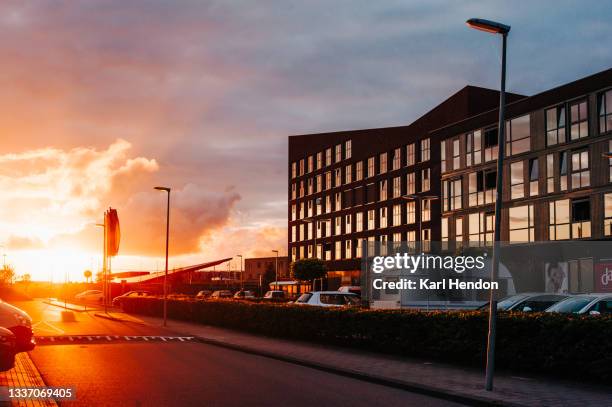 sunset on an industrial estate - stock photo - groningen city stock-fotos und bilder