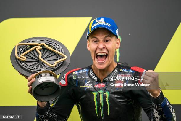 Fabio Quartararo of France and Monster Energy Yamaha MotoGP screams on the podium after his win during the race of the MotoGP Monster Energy British...