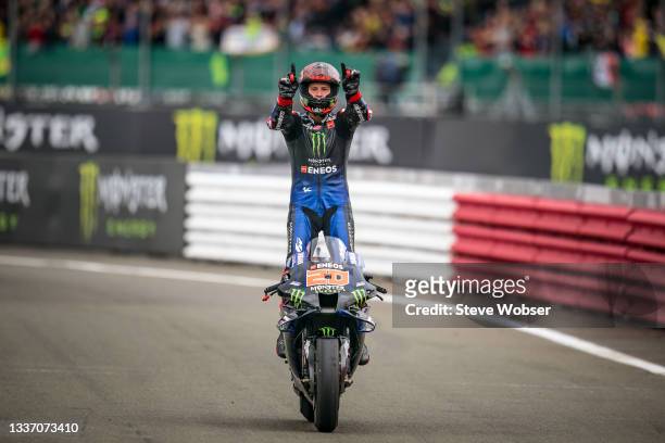 Fabio Quartararo of France and Monster Energy Yamaha MotoGP rolls into parc ferme - he stands on the bike after his win during the race of the MotoGP...