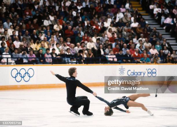 Christine Hough and Doug Ladret of Canada perform in the Free Skate event of the Pairs Figure Skating competition at the 1988 Winter Olympic Games on...