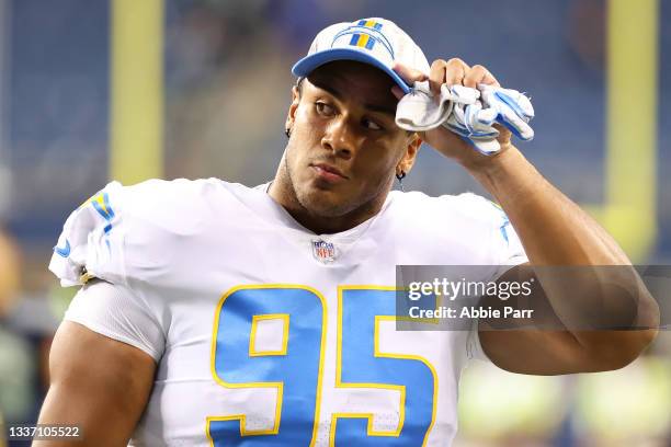 Christian Covington of the Los Angeles Chargers looks on after the NFL preseason game against the Seattle Seahawks at Lumen Field on August 28, 2021...