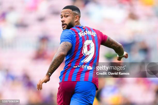 Memphis Depay of FC Barcelona looks on during the La Liga Santader match between FC Barcelona and Getafe CF at Camp Nou on August 29, 2021 in...