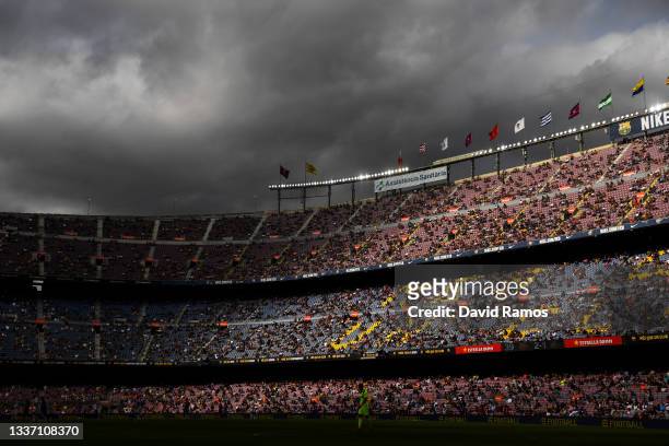 Fans follow the action from their seats keepìng social distance measures during the La Liga Santader match between FC Barcelona and Getafe CF at Camp...