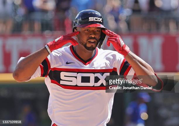 Eloy Jimenez of the Chicago White Sox celebrates as he runs the bases after hitting a three run home run in the 5th inning against the Chicago Cubs...