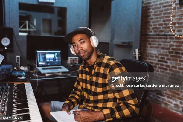 portrait of audio engineer working in music recording studio, singer rapper songwriter - sound producer stock pictures, royalty-free photos & images