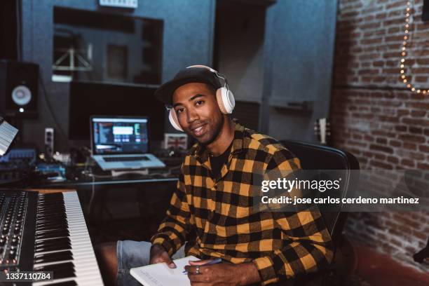 portrait of audio engineer working in music recording studio, singer rapper songwriter - music producer stock pictures, royalty-free photos & images