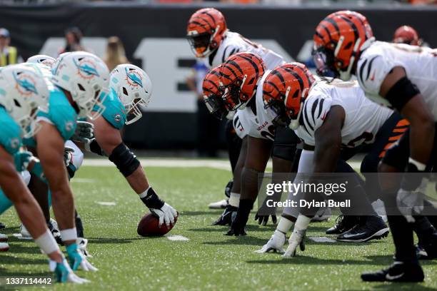 The Miami Dolphins and Cincinnati Bengals line up for a play in the first quarter during a preseason game at Paul Brown Stadium on August 29, 2021 in...