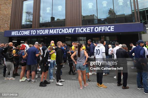 Fans queue up outside the ticket office ahead of the Premier League match between Tottenham Hotspur and Watford at Tottenham Hotspur Stadium on...