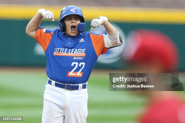 Jackson Surma of Team Michigan celebrates after hitting a two-RBI double during the fifth inning of the 2021 Little League World Series game against...