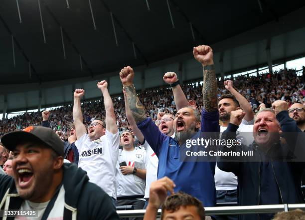 Fans of Tottenham Hotspur celebrate the goal during the Premier League match between Tottenham Hotspur and Watford at Tottenham Hotspur Stadium on...