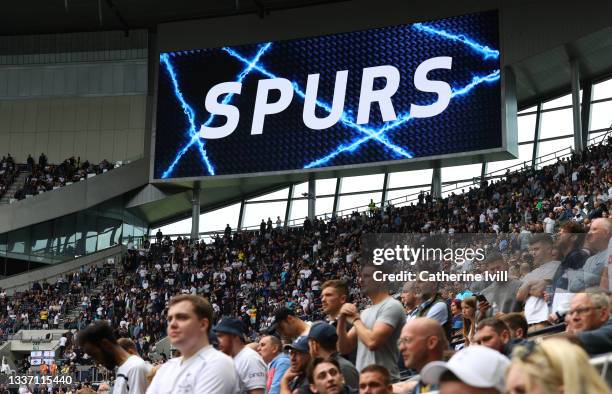 Fans in the south stand under the big screen during the Premier League match between Tottenham Hotspur and Watford at Tottenham Hotspur Stadium on...