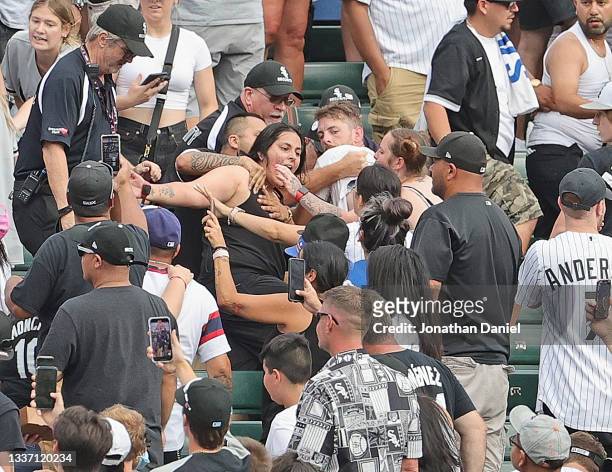 Fight breaks out in the left field bleachers as the Chicago White Sox take on the Chicago Cubs at Guaranteed Rate Field on August 29, 2021 in...