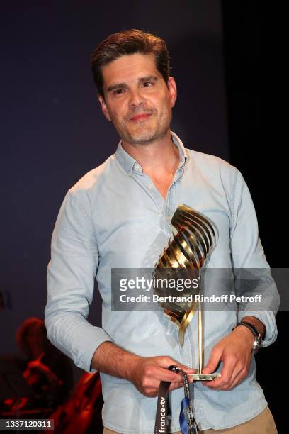 Yann Gozlan poses with the Valois du Public award following the spectators' online vote on the festival website for the movie "Boite noire" during...