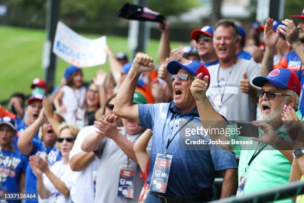 Fans cheer for Team Michigan during the first inning of the 2021 Little League World Series game against Team Ohio at Howard J. Lamade Stadium on...