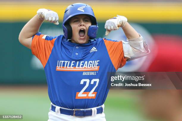 Jackson Surma of Team Michigan celebrates hitting a two-run double in the fifth inning of the 2021 Little League World Series against Team Ohio at...
