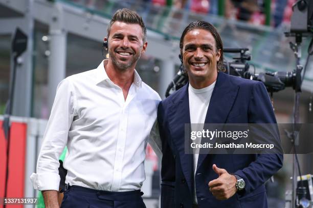 Former players Andrea Barzagli and Alessandro Matri now pundits for DAZN pose for a photo prior to the Serie A match between AC Milan and Cagliari...