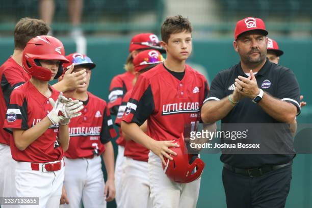 Team Ohio congratulates Team Michigan after the 2021 Little League World Series game at Howard J. Lamade Stadium on August 29, 2021 in Williamsport,...