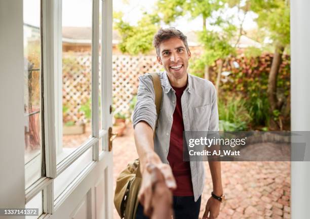 real estate agent shaking hand with potential client - new home pov stock pictures, royalty-free photos & images