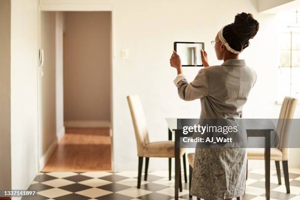 real estate agent doing a video walk-through of a home for sale - real estate appraisal stock pictures, royalty-free photos & images