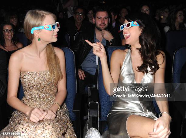 Taylor Swift and Selena Gomez in the audience at the 2011 American Music Awards at the Nokia Theatre L.A. LIVE on November 20, 2011 in Los Angeles,...
