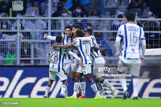 Erick Sánchez of Pachuca celebrates with teammates after the first goal of his team scored by an own goal from Yoshimar Yotún of Cruz Azul during the...