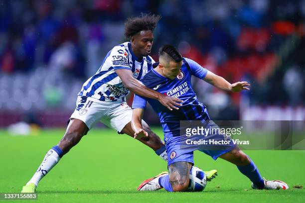 Aviles Hurtado of Pachuca battles for possesion with Roberto Alvarado of Cruz Azul during the 7th round match between Cruz Azul and Pachuca as part...