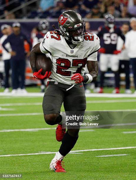 Ronald Jones II of the Tampa Bay Buccaneers rushes for a 13 yard touchdown against the Houston Texans during a NFL preseason game at NRG Stadium on...