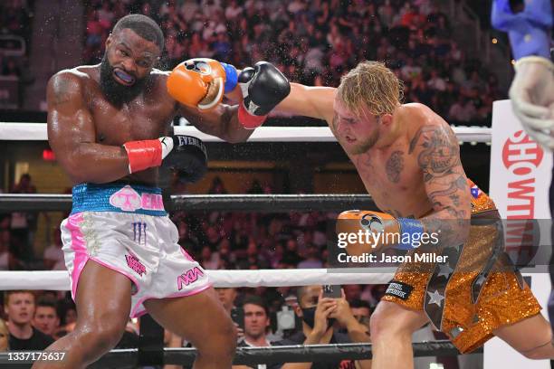 Jake Paul fights Tyron Woodley in their cruiserweight bout during a Showtime pay-per-view event at Rocket Morgage Fieldhouse on August 29, 2021 in...