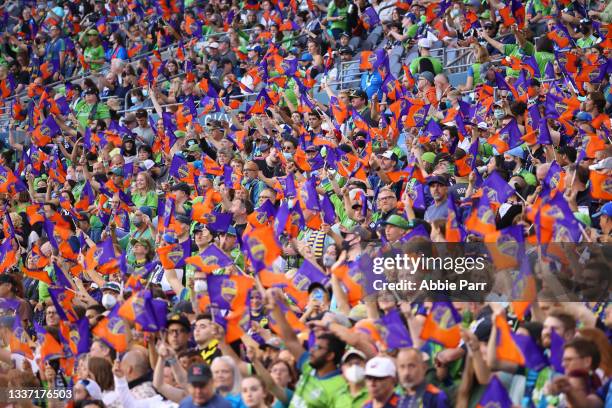 Fans wave their flags before a game between the Seattle Sounders and Portland Timbers at Lumen Field on August 29, 2021 in Seattle, Washington.