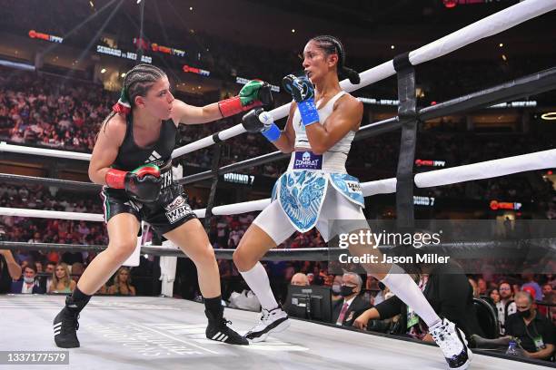 Amanda Serrano fights Yamileth Mercado in their WBC/WBO featherweight world championship during a Showtime pay-per-view event at Rocket Morgage...