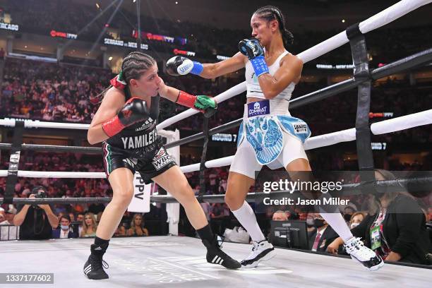 Amanda Serrano fights Yamileth Mercado in their WBC/WBO featherweight world championship during a Showtime pay-per-view event at Rocket Morgage...