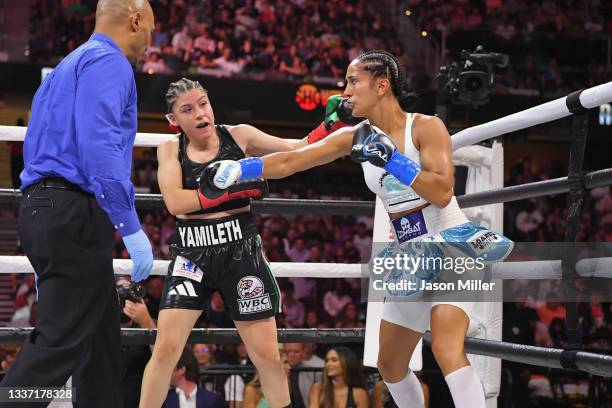 Amanda Serrano fights Yamileth Mercado in their WBC/WBO featherweight world championship during a Showtime pay-per-view event at Rocket Morgage...