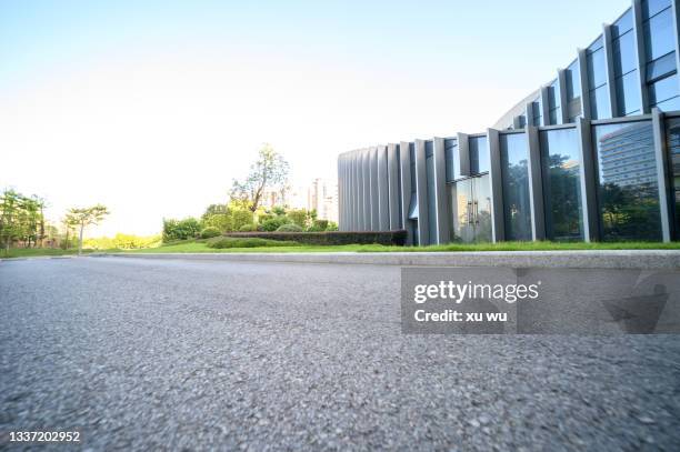 modern building empty pavement asphalt road - curtain wall facade stock pictures, royalty-free photos & images