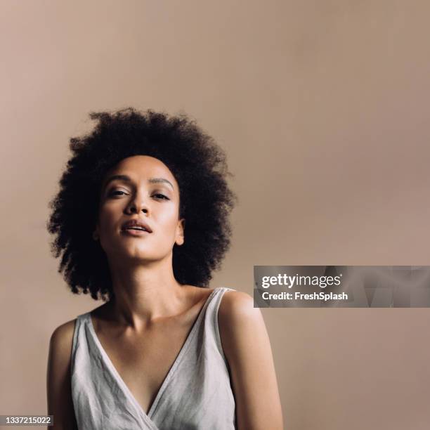 portrait of a beautiful mixed race mid adult woman (square) - v hals stockfoto's en -beelden