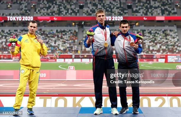 Silver medalist Ihor Tsvietov of Team Ukraine, gold medalist Dmitrii Safronov of Team RPC and bronze medalist Artem Kalashian of Team RPC pose during...
