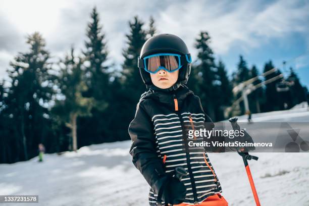 smiling cute boy on skiing. - skiing helmet imagens e fotografias de stock