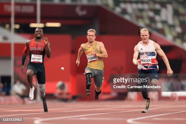 Sherman Isidro Guity Guity of Team Costa Rica, Johannes Floors of Team Germany and Jonnie Peacock of Team Great Britain compete in the men's 100m -...