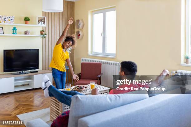 black father and his daughter have fun and play charades together. - pantomime stock pictures, royalty-free photos & images