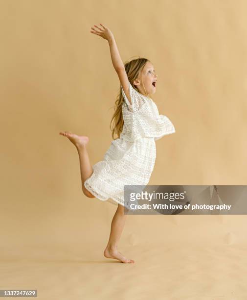 one little girl 6 years old dancing studio shot - 6 7 years stock pictures, royalty-free photos & images