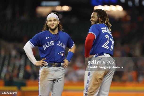 Bo Bichette and Vladimir Guerrero Jr. #27 of the Toronto Blue Jays while playing the Detroit Tigers at Comerica Park on August 27, 2021 in Detroit,...