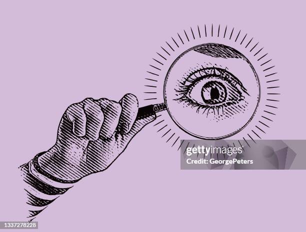 hand holding magnifying glass with large eye - hand touch stock illustrations