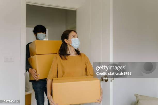 happy couple moving new house. - couple entering the theater stock pictures, royalty-free photos & images