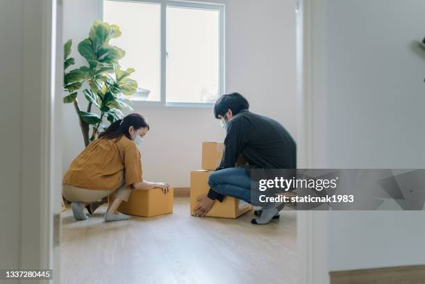 happy couple moving new house. - couple entering the theater stock pictures, royalty-free photos & images