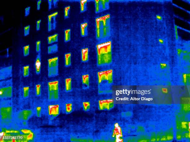 thermal image of a building in winter time.  one person is passing through. germany. - thermal image stock pictures, royalty-free photos & images