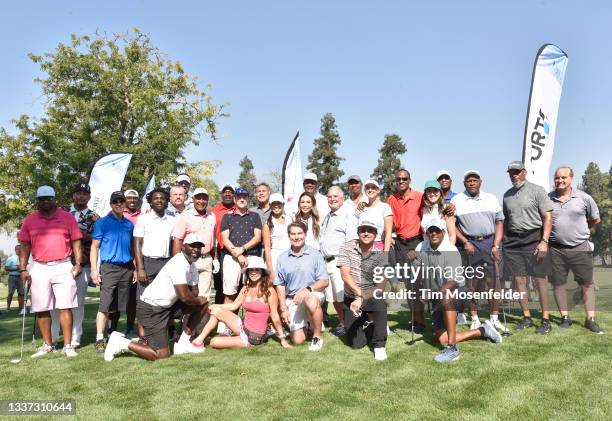 Celebrities pose for a group picture during the Inaugural Phil Oates Celebrity Golf Classic at North Ridge Country Club on August 30, 2021 in Fair...