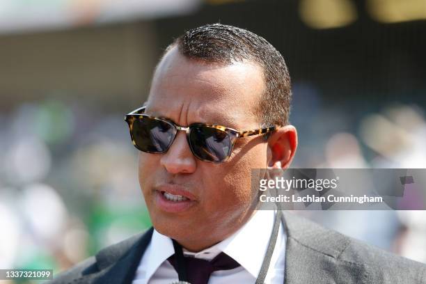 Broadcaster and former MLB player Alex Rodriguez looks on from the field before the game between the Oakland Athletics and the New York Yankees at...